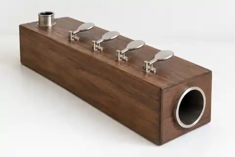 Design visualisation of the Four-Finger Echo Box: walnut body, voice inlet, four silver keys and output.